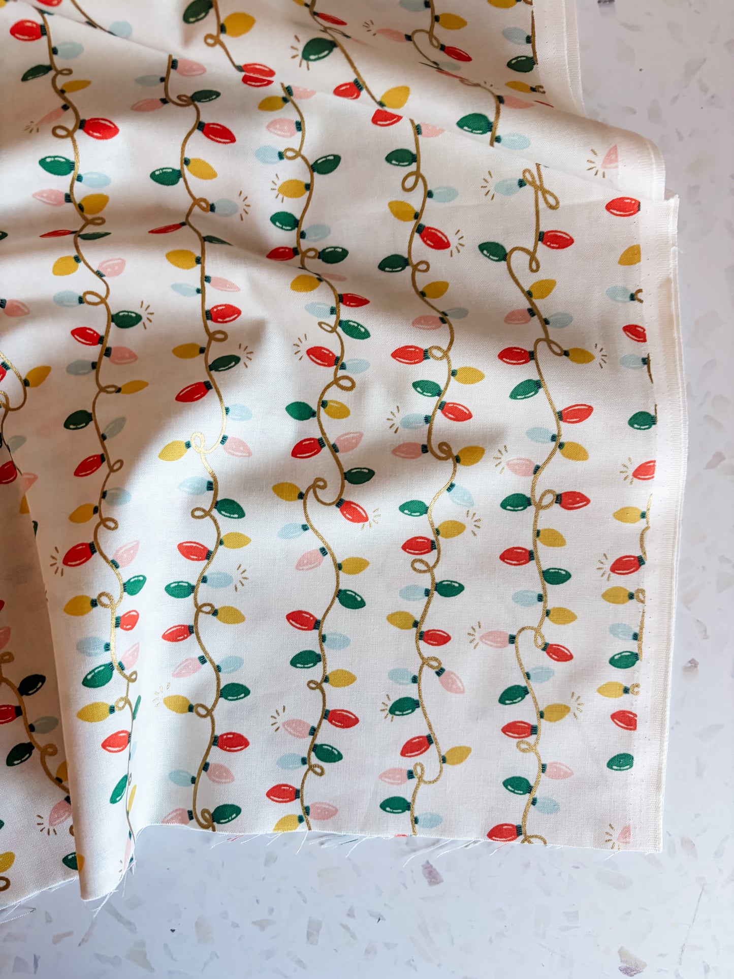 Holiday Classics Holiday Lights Cotton Fabric in Cream Metallic