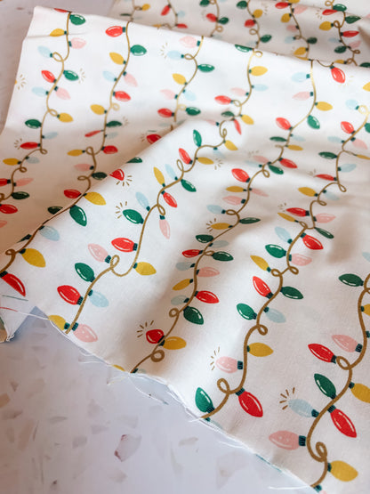 Holiday Classics Holiday Lights Cotton Fabric in Cream Metallic