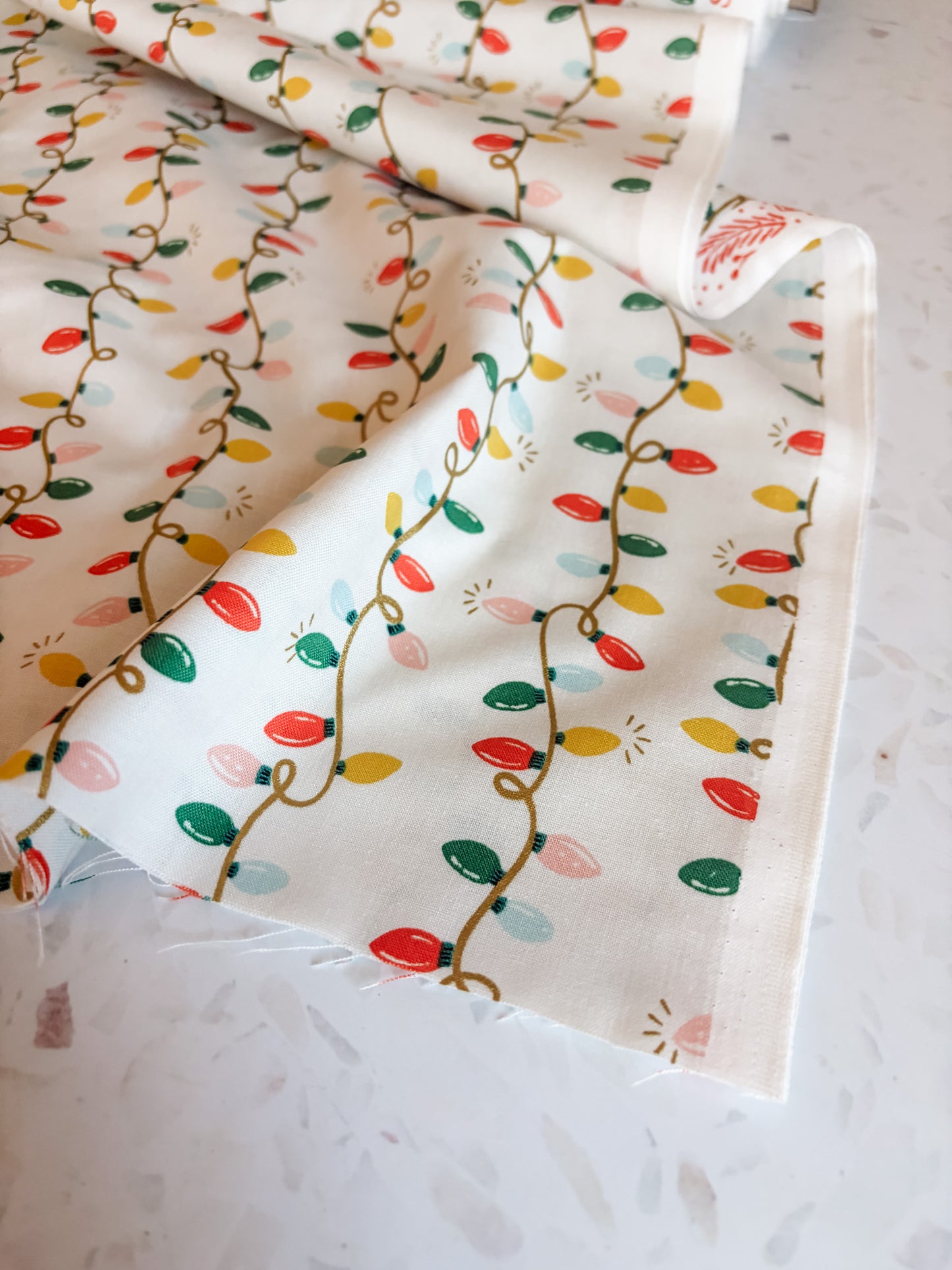 Holiday Classics Holiday Lights Cotton Fabric in Cream Metallic