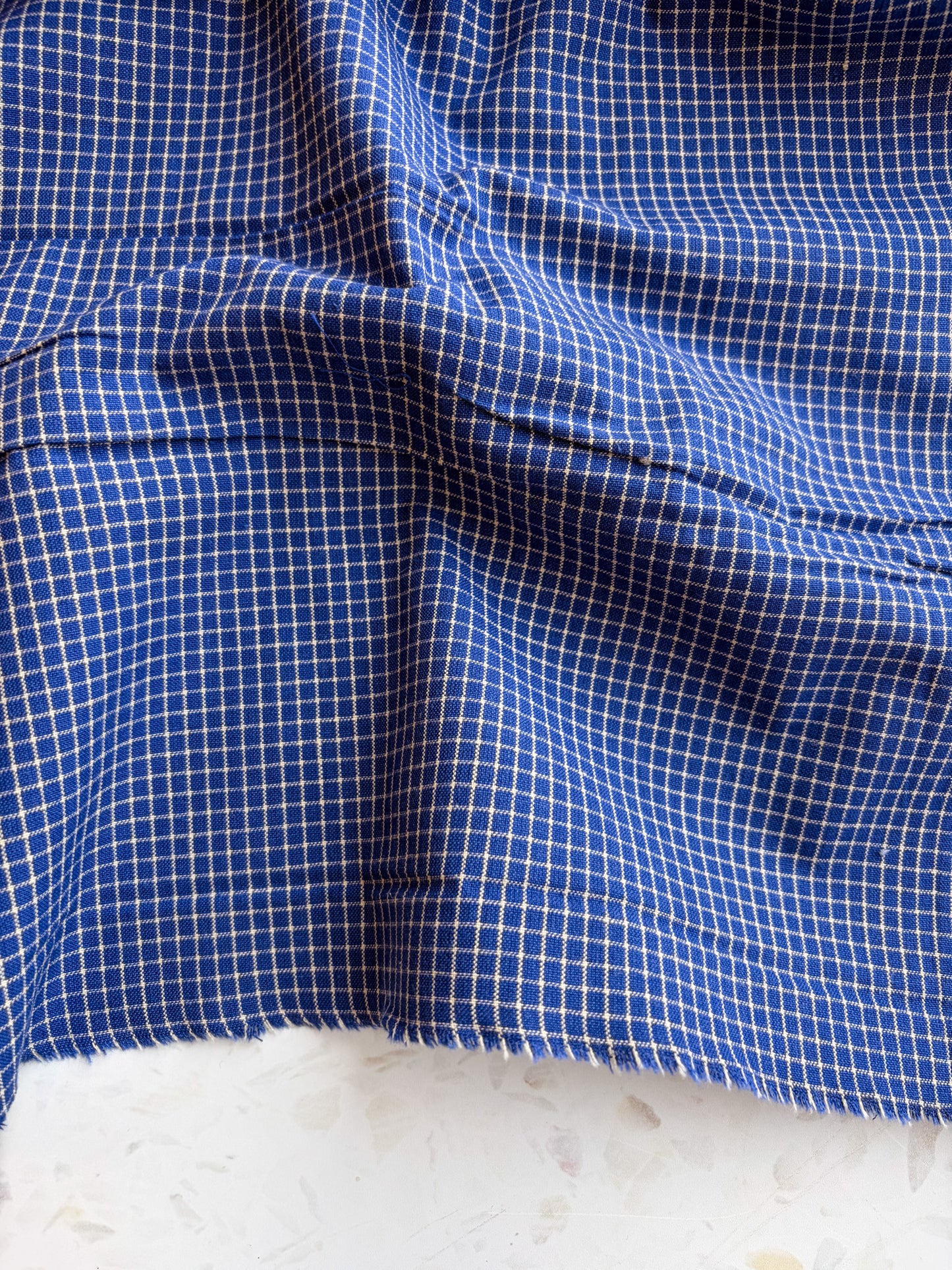 Gathering Cloth Merchant Check in Blue Hour