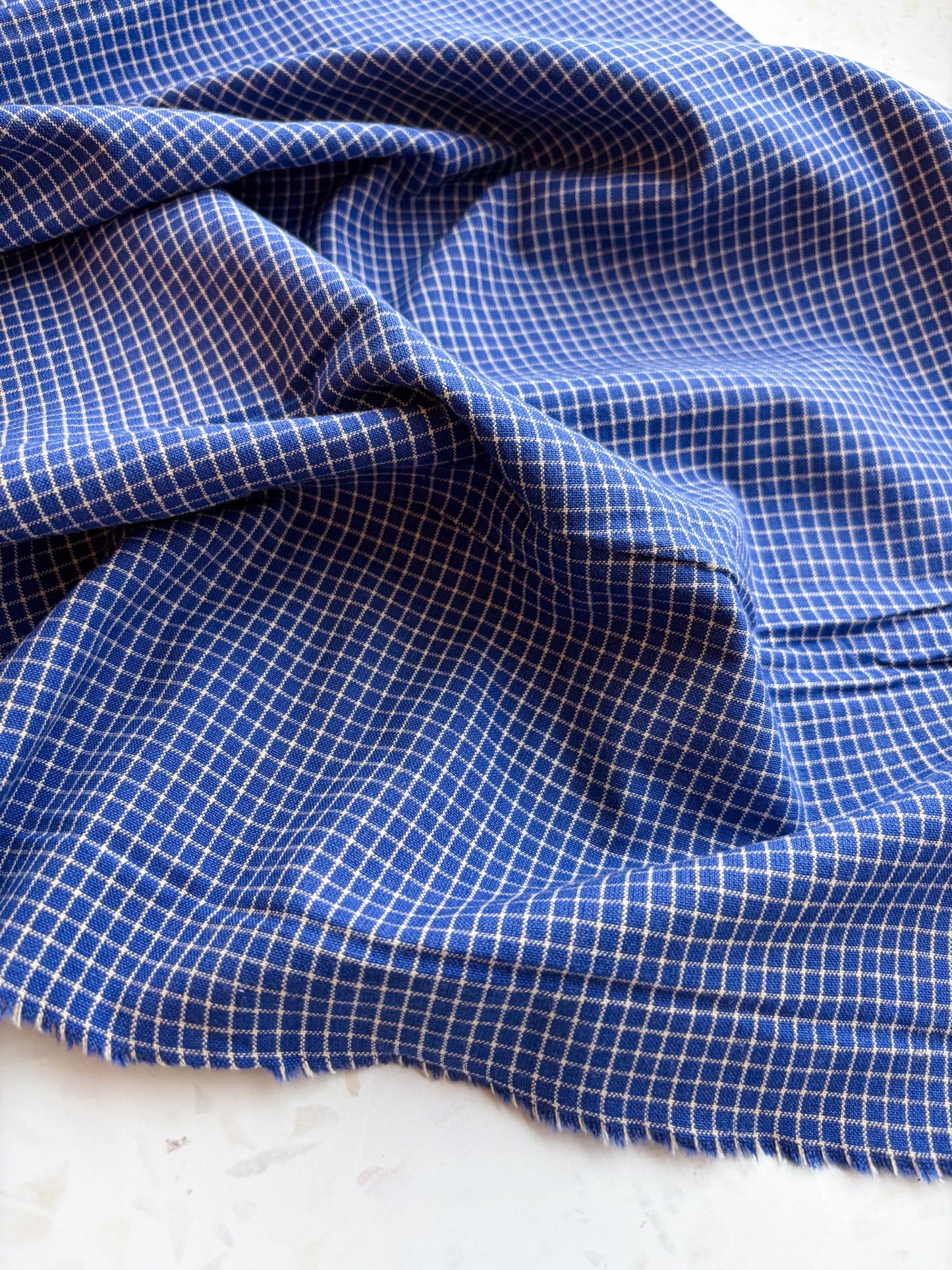Gathering Cloth Merchant Check in Blue Hour