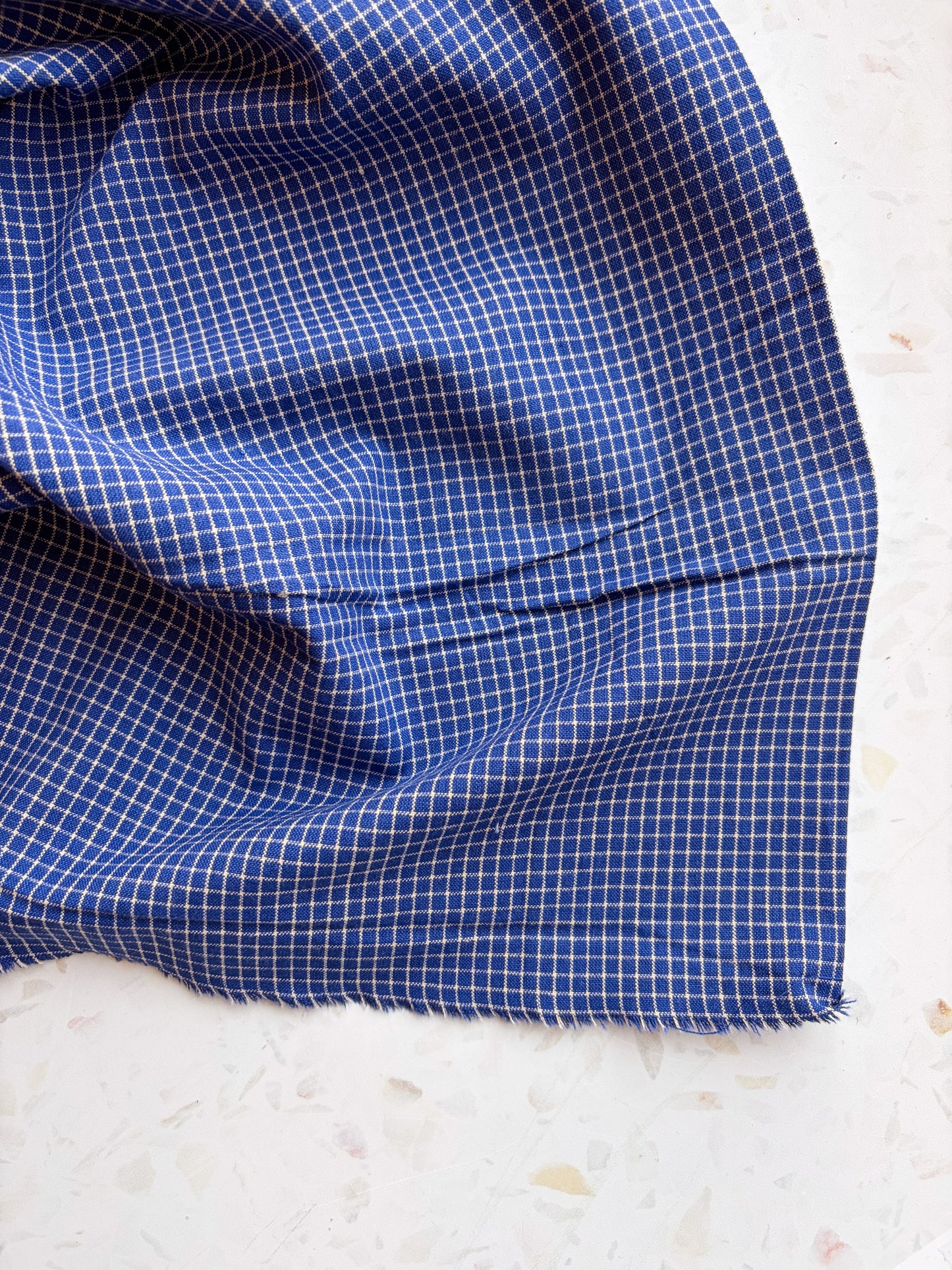 Gathering Cloth Merchant Check in Blue Hour
